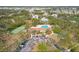 Beautiful aerial view featuring pool, tennis courts and well maintained grounds at 1244 E Corktree Cir, Port Charlotte, FL 33952