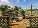 Deck view offering a serene pond and lush landscaping at 1244 E Corktree Cir, Port Charlotte, FL 33952