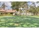 Outdoor basketball court surrounded by mature trees and lush greenery, ideal for active recreation at 1244 E Corktree Cir, Port Charlotte, FL 33952