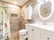 Bathroom with tiled shower, updated fixtures, and bright lighting for a modern feel at 1244 E Corktree Cir, Port Charlotte, FL 33952