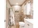 Bathroom featuring a tiled shower, medicine cabinet, and updated toilet at 1244 E Corktree Cir, Port Charlotte, FL 33952