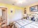 A sunlit bedroom features a ceiling fan and a closet for ample storage at 1244 E Corktree Cir, Port Charlotte, FL 33952
