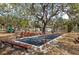 Outdoor bocce ball court with mature landscaping and ample seating at 1244 E Corktree Cir, Port Charlotte, FL 33952