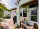 Welcoming front porch featuring charming decor, including a unique owl statue and dragonfruit at 1244 E Corktree Cir, Port Charlotte, FL 33952