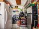 Functional garage with laundry machines, a refrigerator, and other storage solutions at 1244 E Corktree Cir, Port Charlotte, FL 33952