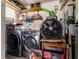 Garage area featuring laundry machines, a storage fan, and a red generator at 1244 E Corktree Cir, Port Charlotte, FL 33952