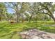 Recreational horseshoe pits on a green lawn surrounded by mature shade trees, offering a relaxing outdoor activity at 1244 E Corktree Cir, Port Charlotte, FL 33952