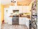 Bright kitchen featuring updated appliances, granite countertops, and ample cabinet space at 1244 E Corktree Cir, Port Charlotte, FL 33952