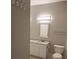 Well-lit bathroom with a granite countertop vanity and neutral color palette at 4307 Bayside Village Dr # 103, Tampa, FL 33615