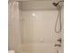 Clean bathroom featuring a shower and tub with a white tiled surround at 4307 Bayside Village Dr # 103, Tampa, FL 33615