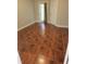 Bedroom with wood-look tile flooring and ample natural light at 4307 Bayside Village Dr # 103, Tampa, FL 33615