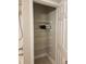 Bathroom closet featuring wire shelving, providing ample storage space at 4307 Bayside Village Dr # 103, Tampa, FL 33615