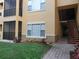 Inviting exterior view with landscaped front and staircase access in a well-maintained building at 4307 Bayside Village Dr # 103, Tampa, FL 33615