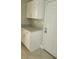 Kitchen features white cabinets, granite counters, and a backdoor at 4307 Bayside Village Dr # 103, Tampa, FL 33615