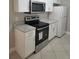 Modern kitchen features stainless steel appliances and granite counters at 4307 Bayside Village Dr # 103, Tampa, FL 33615