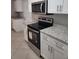 Kitchen featuring stainless steel appliances and granite countertops at 4307 Bayside Village Dr # 103, Tampa, FL 33615