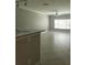 Bright living room featuring tiled floors, neutral colors, and ample natural light at 4307 Bayside Village Dr # 103, Tampa, FL 33615