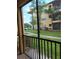Enjoy the screened-in patio with views of the building's well-manicured lawn at 4307 Bayside Village Dr # 103, Tampa, FL 33615