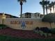 Welcoming entrance sign showcasing the Beachwalk Condominiums name with lush greenery at 4307 Bayside Village Dr # 103, Tampa, FL 33615