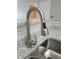 Kitchen sink with stainless steel faucet and granite countertops at 4307 Bayside Village Dr # 103, Tampa, FL 33615