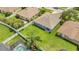 Aerial view of the home with a large backyard, pool and partial fencing at 5145 Prairie View Way, Wesley Chapel, FL 33545