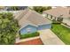 Aerial elevation of the home with well-manicured shrubbery and a partial driveway at 5145 Prairie View Way, Wesley Chapel, FL 33545