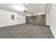 Spacious garage with concrete floors, and an electrical panel at 5145 Prairie View Way, Wesley Chapel, FL 33545