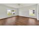 Large bright main bedroom has laminate floors and windows at 5145 Prairie View Way, Wesley Chapel, FL 33545