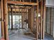 Home in the middle of renovation, with exposed wood framing, utilities and flooring at 801 Marlin Dr, Punta Gorda, FL 33950