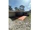 Backyard with patio and some grass at 9504 W Cluster Ave, Tampa, FL 33615