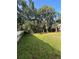 Expansive backyard with well-maintained lawn and a mix of chain link and privacy fencing at 9504 W Cluster Ave, Tampa, FL 33615