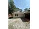 Backyard featuring the house and screened in patio with brick trim at 9504 W Cluster Ave, Tampa, FL 33615