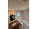 Cozy bathroom features a tiled shower, granite vanity, and tiled floor at 9504 W Cluster Ave, Tampa, FL 33615