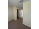 Bedroom features a standard closet and wall to wall carpet at 9504 W Cluster Ave, Tampa, FL 33615