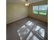 Comfortable bedroom with blinds, carpet, and a ceiling fan providing ample light at 9504 W Cluster Ave, Tampa, FL 33615