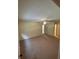 Large bedroom with neutral walls, carpet flooring, and a ceiling fan fixture at 9504 W Cluster Ave, Tampa, FL 33615