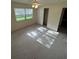 Bedroom with window and a ceiling fan, in a home ready for new occupants at 9504 W Cluster Ave, Tampa, FL 33615