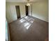 Standard bedroom with a ceiling fan, closet, and neutral carpeting at 9504 W Cluster Ave, Tampa, FL 33615