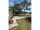 Pictured is the driveway of a home with mature trees at 9504 W Cluster Ave, Tampa, FL 33615