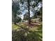 A charming single Gathering home with mature trees and a well-manicured lawn at 9504 W Cluster Ave, Tampa, FL 33615