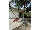 Welcoming front entrance with mulched landscaping and a wide sidewalk leading to the front door at 9504 W Cluster Ave, Tampa, FL 33615