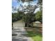 Traditional single-story home featuring a two-car garage and well-maintained lawn at 9504 W Cluster Ave, Tampa, FL 33615