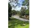Charming home with a well-maintained front yard, showcasing a neatly paved driveway at 9504 W Cluster Ave, Tampa, FL 33615