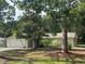 Charming single-story home featuring a two-car garage and well-maintained lawn at 9504 W Cluster Ave, Tampa, FL 33615
