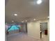 Comfortable living room with natural light, recessed lighting and a ceiling fan at 9504 W Cluster Ave, Tampa, FL 33615