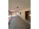 Covered patio with kitchen view, perfect for outdoor dining and entertaining at 9504 W Cluster Ave, Tampa, FL 33615