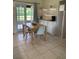 Dining area with a table, chairs, and French doors leading to the outdoors at 1409 Yorkshire St, Port Charlotte, FL 33952