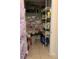 Walk-in pantry with metal shelving, containing assorted kitchen essentials and food items at 1409 Yorkshire St, Port Charlotte, FL 33952
