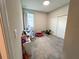 Cozy bedroom with neutral tones, ample space, and a window offering natural light creating a comfortable atmosphere at 3567 74Th Avenue E Cir, Sarasota, FL 34243