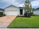 Charming single-story home with well-maintained landscaping and a brick driveway at 3567 74Th Avenue E Cir, Sarasota, FL 34243